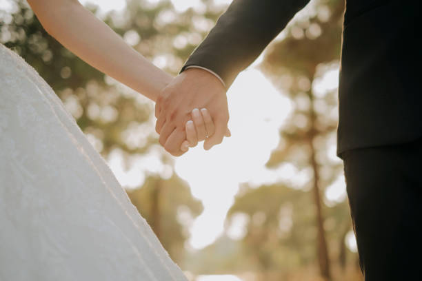 istock partial view of lovers holding hands 1357000373