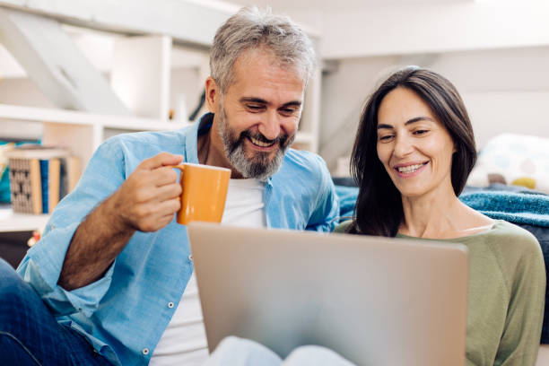 istock Mature couple working online together 1357001792