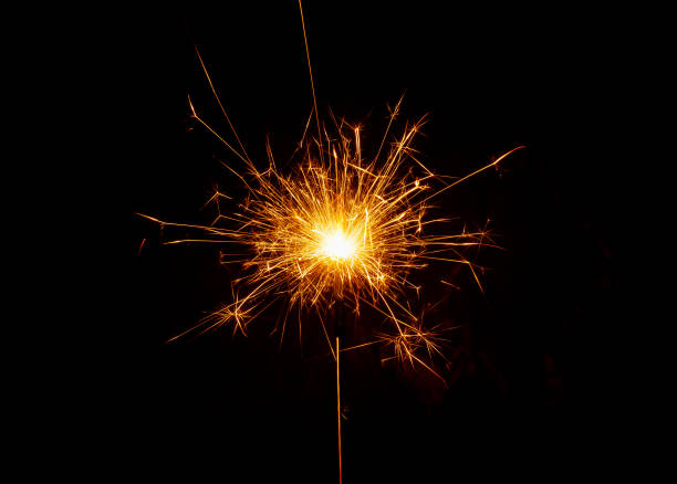 istock Bright burning sparkler on the dark background 1357002850