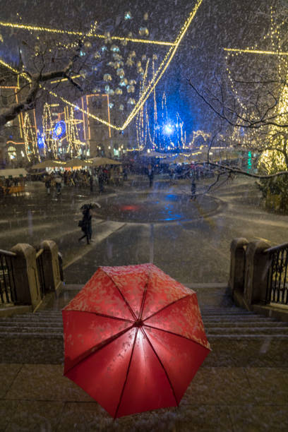 snowing on festive presern square at night, ljubljana - ljubljana december winter christmas imagens e fotografias de stock