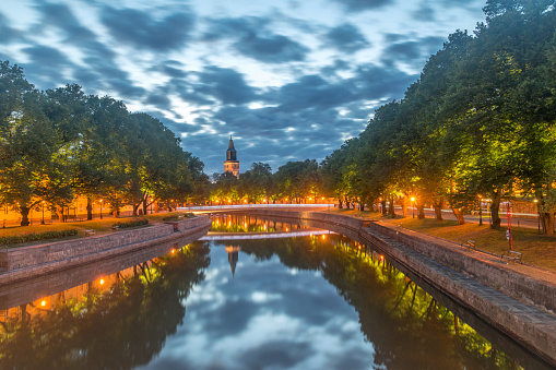 Early morning view Aurajoki river with Turku Cathedral in the background in Turku, Finland.