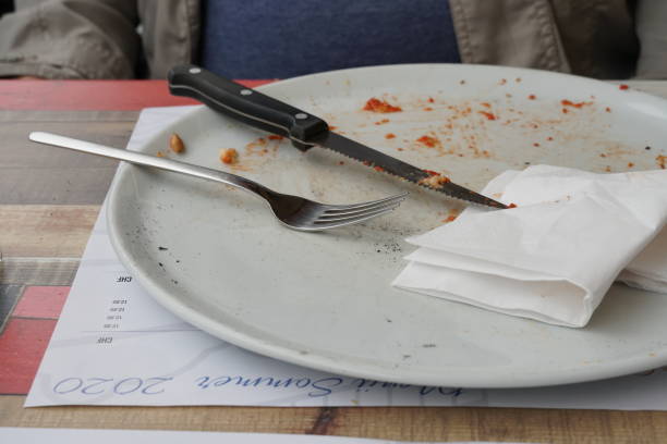 istock White empty plate with bread crumbs of pizza. 1357005304