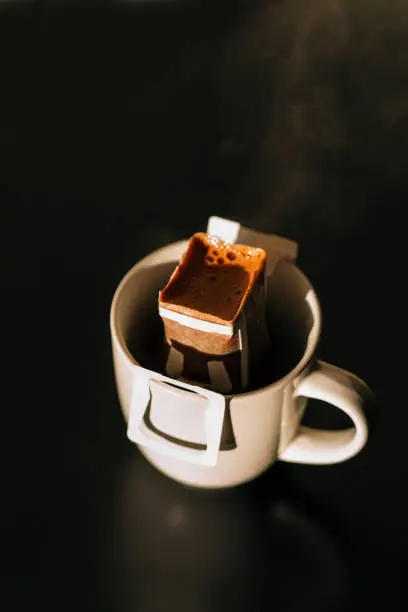 drip coffee bag in a mug , coffee concept