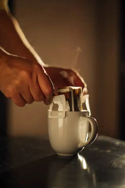 drip coffee bag in a mug , coffee concept