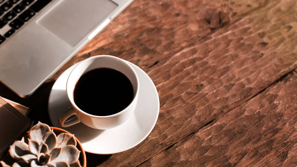 istock desktop with coffee , photo tinting 1357008969