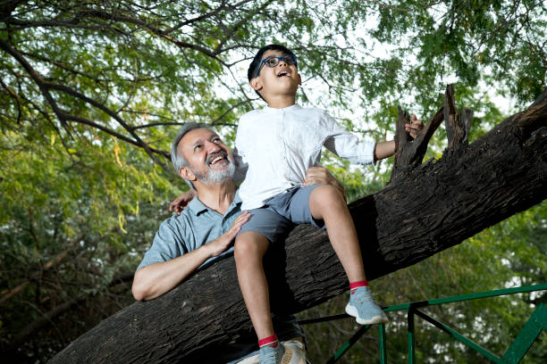 istock Old man with grandson admiring nature 1357009012