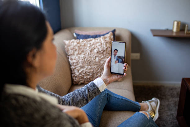 istock Woman making video call with doctor 1357009864