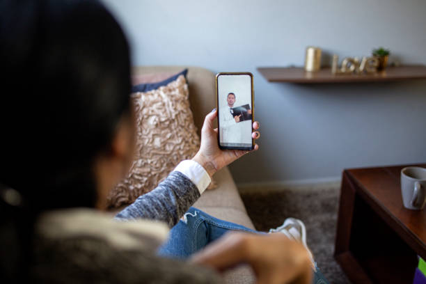 istock Woman making video call with doctor 1357009869