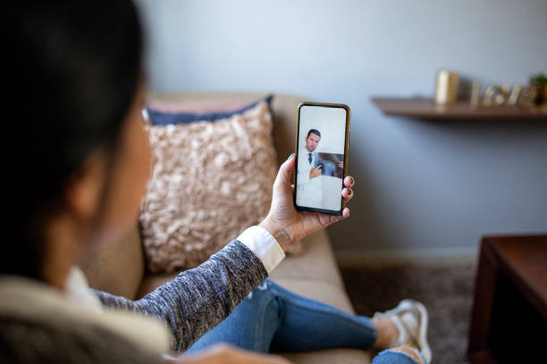 istock Woman making video call with doctor 1357009877