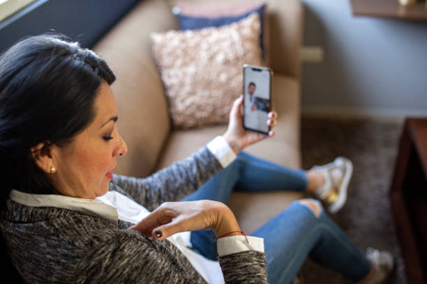 istock Woman making video call with doctor 1357009880