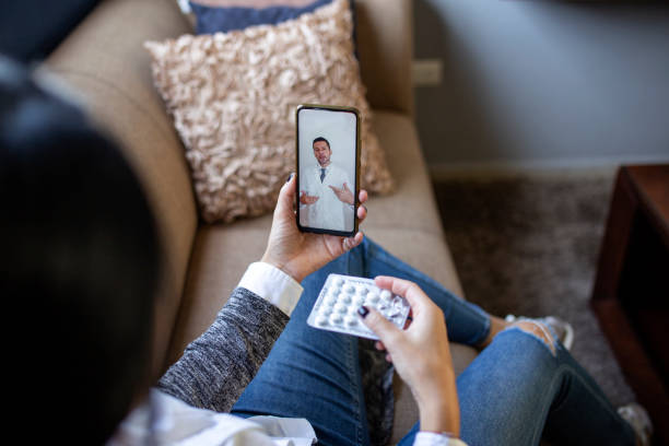 istock Woman making video call with doctor 1357009954