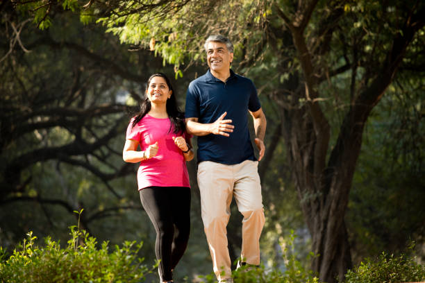 istock Couple jogging at park 1357010739