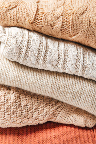 istock winter clothes on a white background, cozy winter 1357013298