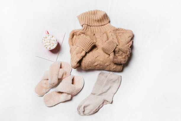 istock winter clothes on a white background, cozy winter 1357013303