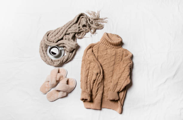 istock winter clothes on a white background, cozy winter 1357013304