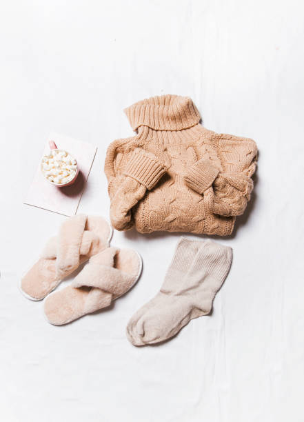 istock winter clothes on a white background, cozy winter 1357013319