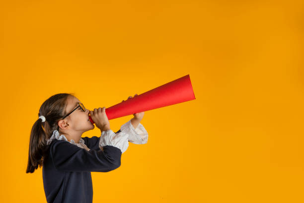 istock Young Girl with Megaphone 1357013398