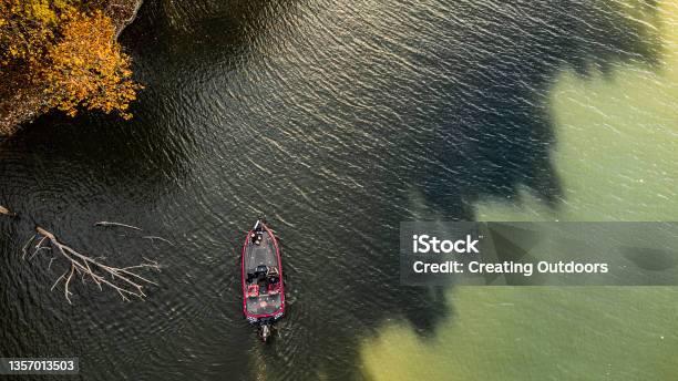 Bass Fisherman Fishing Lake During Fall Stock Photo - Download Image Now - Fishing, Nautical Vessel, Sport
