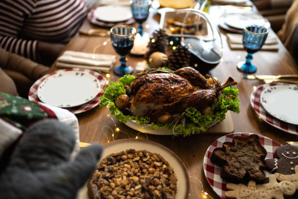 istock Hands serving a roast turkey on Christmas at home 1357014338