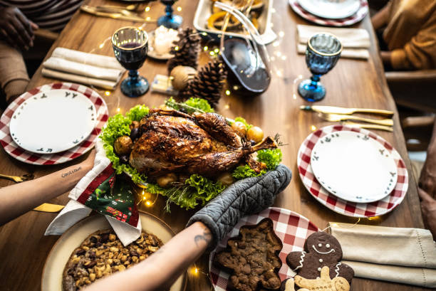 istock Hands serving a roast turkey on Christmas at home 1357014345