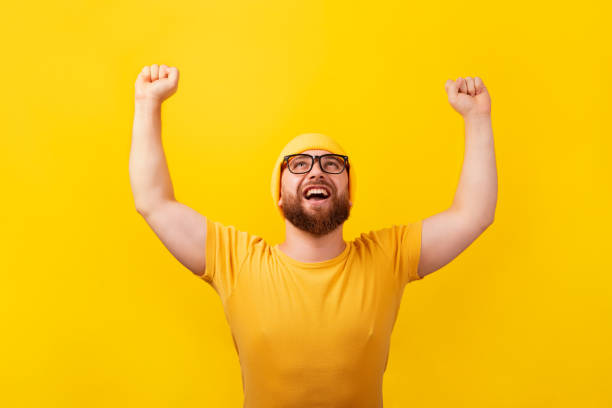 istock happy winner man looking up 1357016369