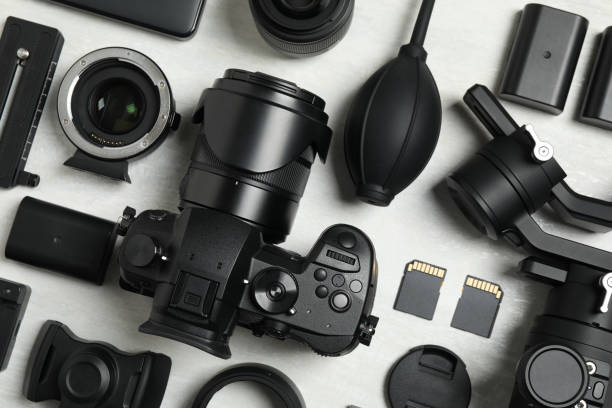 istock Flat lay composition with camera and video production equipment on light background 1357017275