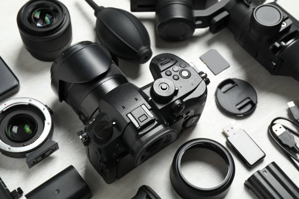 istock Camera and video production equipment on light background 1357017393