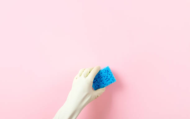 istock hand in a green rubber glove 1357019819