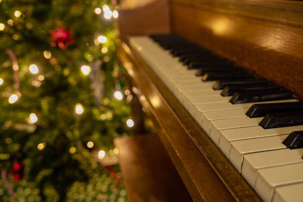 istock Piano in front of Christmas tree 1357021238