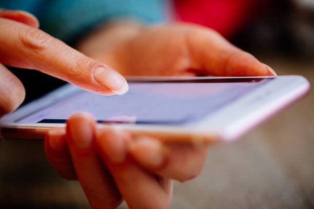 istock Woman touching the phone screen 1357022261