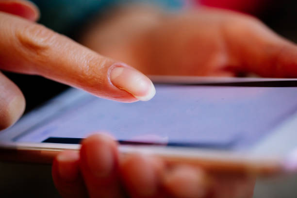 istock Woman touching the phone screen 1357022265
