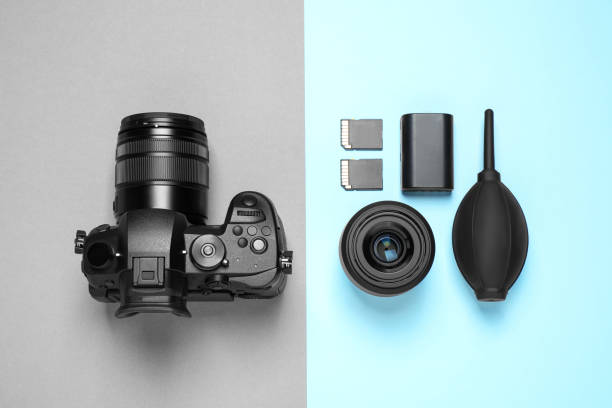 istock Flat lay composition with camera and video production equipment on color background 1357024060