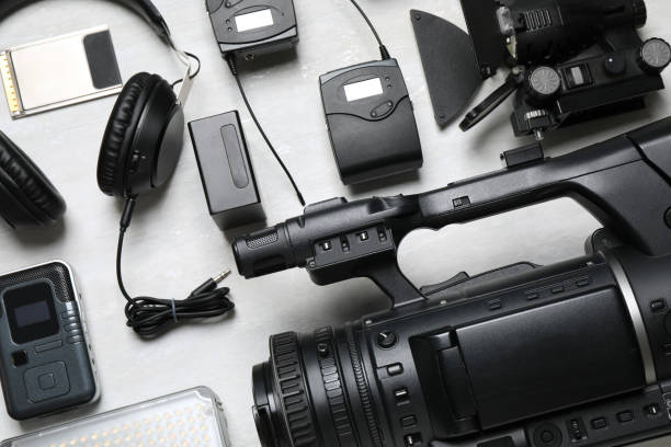 istock Flat lay composition with camera and video production equipment on light grey background 1357024252