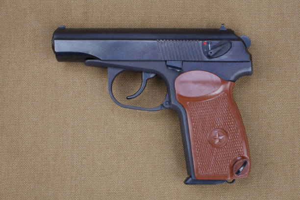 istock 9mm soviet handgun on USSR khaki uniform Soviet–Afghan War (1979-1989) era 1357025768