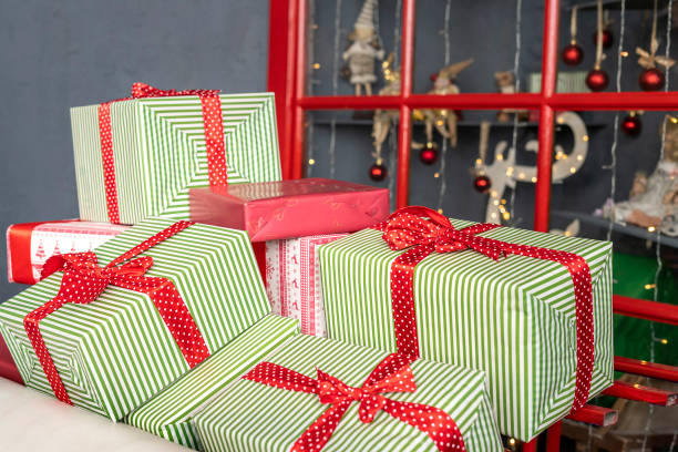 istock Stacks of Christmas presents under a Christmas tree 1357029963