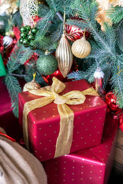 istock Stacks of Christmas presents under a Christmas tree 1357029977