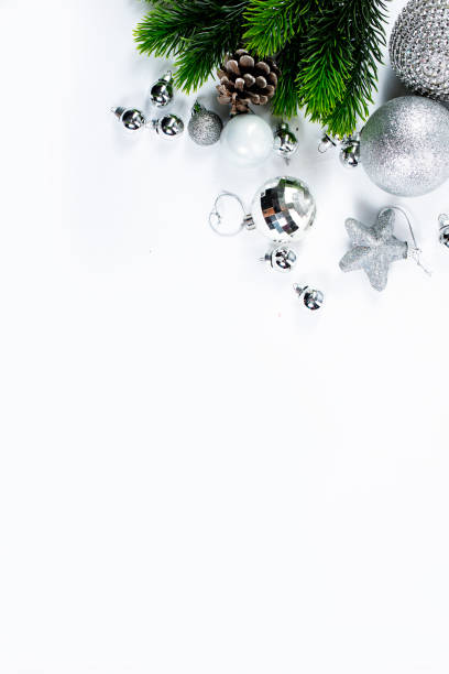 istock Beautiful christmas baubles hanging from graaen branches 1357035106