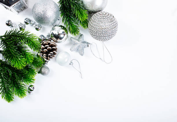 istock Beautiful christmas baubles hanging from graaen branches 1357035110