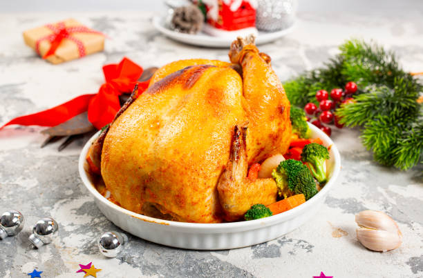 istock christmas chicken. baked chicken. chicken with spice on white plate 1357035146