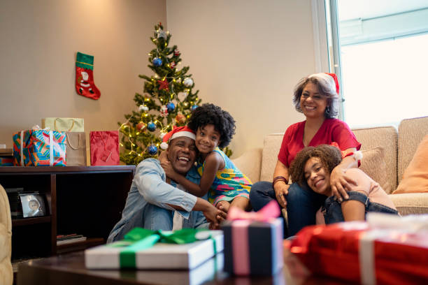 Portrait of family near Christmas tree at home stock photo