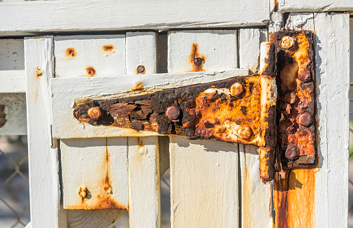 Deteriorated and rusty hinges due to its proximity to the sea.
