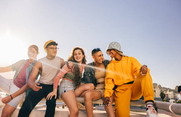 istock Friends laughing with each other outdoors 1357040928