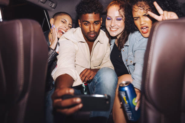 istock Diverse group of friends taking a selfie in a car 1357042215