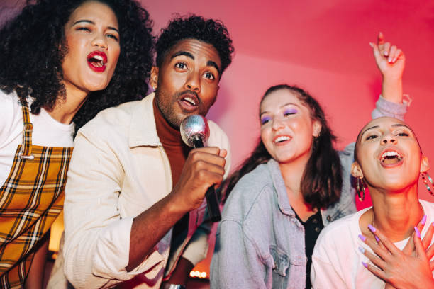 istock Friends singing together on karaoke night 1357042782