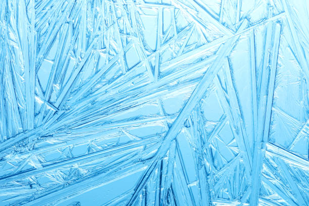 istock Winter frost covered window with a pattern of ice crystals. 1357048460