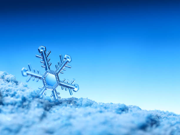 istock Clear snowflake crystal on sparkling snow. Cold or winter time concept. 1357049049