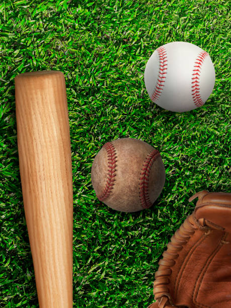istock baseball, glove, ball and bat on field 1357050085