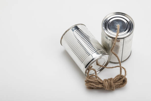 istock Tins cup telephone with rope connecting on white background 1357050967