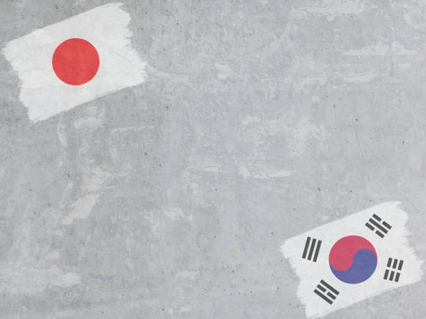 istock Concrete wall painted with Japan and Korea flags with a dry brush 1357062677
