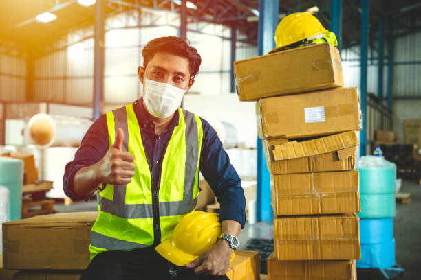 istock Engineer worker wear face shield or disposable face mask working service in factory to prevent Coronavirus(Covid-19) or Air dust pollution in factory inventory 1357063072